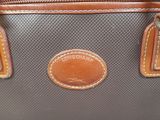 a close up of a purse on a table
