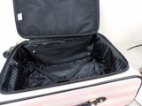 a pink suitcase with a black handle and a black handle