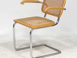 an image of a chair with a wooden seat and a metal frame