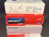 three boxes of airfrance are stacked on top of each other