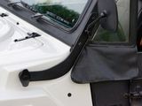 a close up of a vehicle with a dog in the back seat