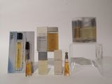 a lot of perfumes that are sitting on a table