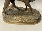 a statue of a man riding a horse on a rock