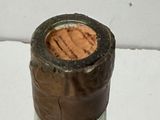 a bottle of wine that has a cork in it