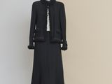 a black dress and jacket on a mannequin mannequin mannequin mannequin mannequin mannequin mannequin mannequin mann