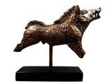 statue of a dog on a black base on a white background