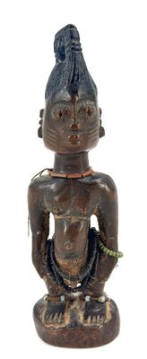 an image of a wooden statue of a man with a flower in his hand