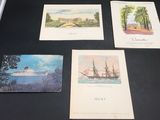 four postcards of different types of ships on display on a table
