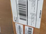 a box with a barcode on it sitting on the floor