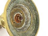 a close up view of a metal object on a white surface