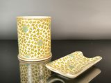 a cup and plate sitting on a black table