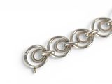 silver plated chain bracelet with oval links on a white background