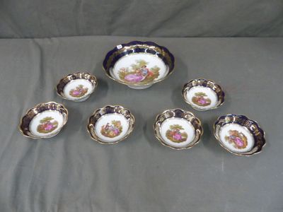 six small bowls and six smaller bowls with flowers on them
