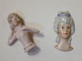 deux figurines représentant une femme et un homme sur un fond blanc