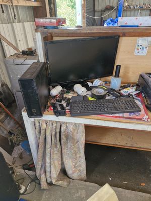 a desk with a computer and a printer on it