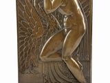 bronze sculpture of a woman kneeling with her hands on her head