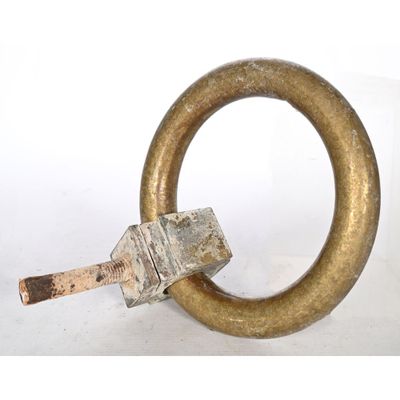a metal ring with a wooden handle on a white surface