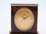 a small clock that is sitting on a table