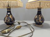 two lamps that are sitting on a table