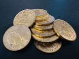 a pile of coins sitting on top of a table