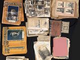 several old books are stacked on top of each other on a table