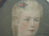 portrait of a young woman with a flower in her hair