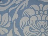 a picture of a blue and white wallpaper with flowers on it