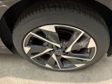 a close up of a car ' s wheel on the street