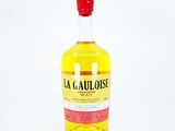 the bottle of la cauloise is sitting on a white surface