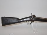 an old gun that is sitting on top of a table