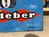 a blue sign with a red diamond and the word jeber on it