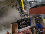 a lot of tools that are on the floor in the garage