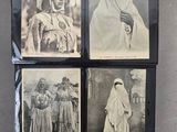 four old black and white photographs of women in traditional clothing