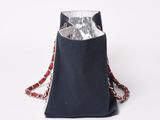 black canvas bag with red and white chain strap