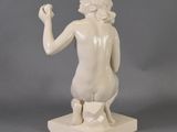 statue of a woman holding a piece of paper in one hand and a piece of paper in the other