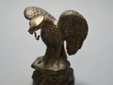 a statue of an eagle holding a fish in its beak