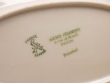 a white plate with a picture of a frog on it
