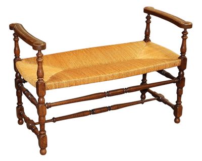 a wooden bench with a woven seat on top of it