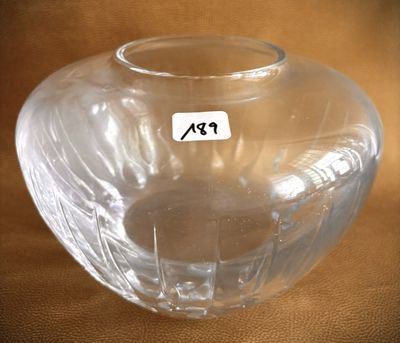 a clear glass vase with a sticker on it