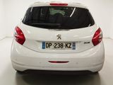 a white car that is parked in a white room