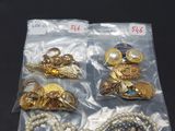 several pieces of jewelry are in a bag on a table