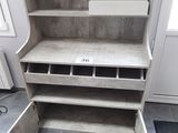 a shelf that has a bunch of drawers in it