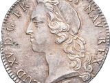 gros plan d'une pièce de monnaie sur laquelle figure une tête de femme