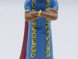 a close up of a figurine of a woman in a blue dress