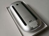 a silver cell phone sitting on top of a white box