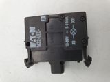 a close up of a black electrical device on a white surface