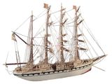 a model of a ship on display on a white surface