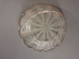 a clear glass bowl with a snowflake design on it