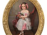 portrait of a young girl in a white dress holding a bouquet of flowers