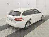 a picture of a white car parked in a garage